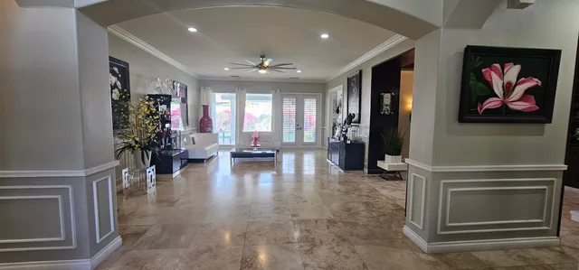 a view of a hallway with a chandelier