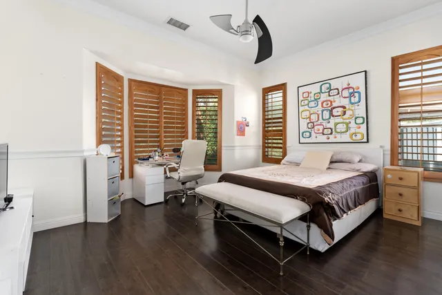 a spacious bathroom with a double vanity sink a large mirror and a shower