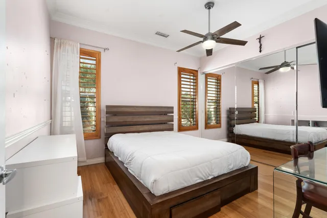 a bedroom with a bed and a fireplace