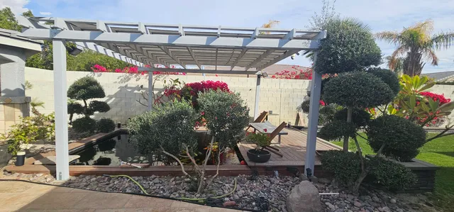 a view of a house with backyard porch and garden
