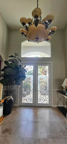 a view of a lobby with a couch and a view of living room
