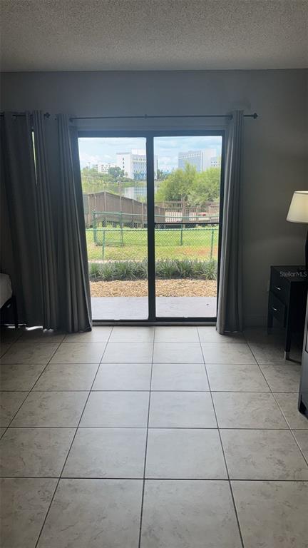 6165 Carrier Drive, Unit 1114 Orlando, FL 32819 - Photo 13 of 31 a view of a room with wooden floor and outdoor space