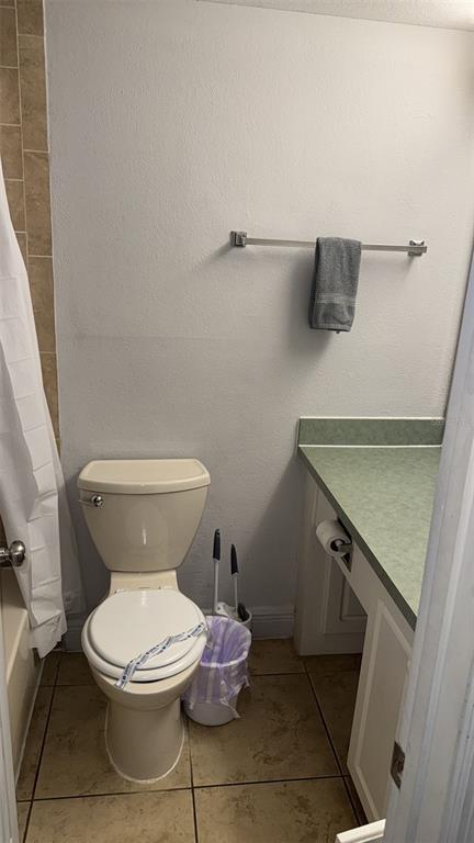 6165 Carrier Drive, Unit 1114 Orlando, FL 32819 - Photo 16 of 31 a bathroom with a toilet and a sink