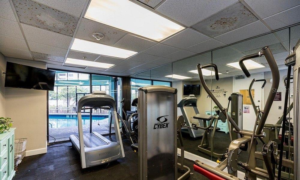 6165 Carrier Drive, Unit 1114 Orlando, FL 32819 - Photo 19 of 31 a dining room with furniture