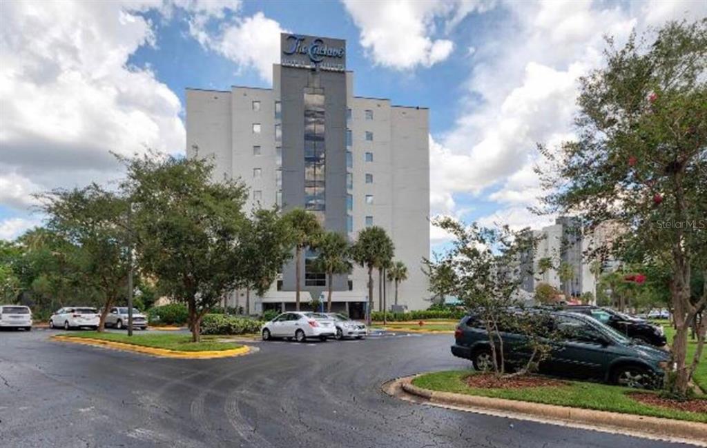 6165 Carrier Drive, Unit 1114 Orlando, FL 32819 - Photo 22 of 31 a view of a playground with a fire pit and trees