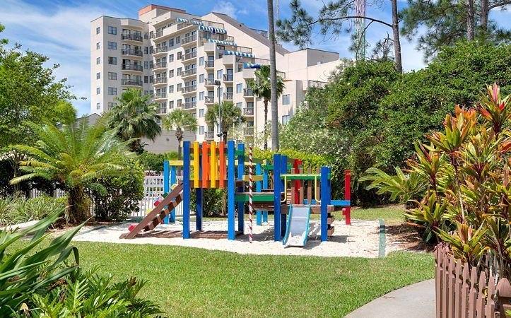 6165 Carrier Drive, Unit 1114 Orlando, FL 32819 - Photo 28 of 31 a view of tall buildings with a big yard and large trees