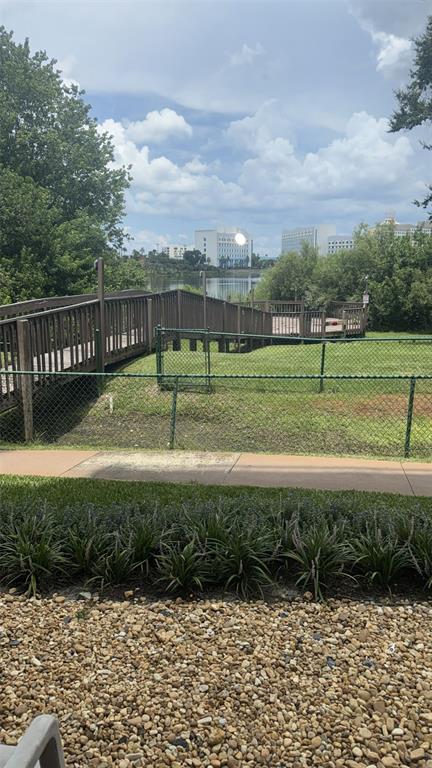 6165 Carrier Drive, Unit 1114 Orlando, FL 32819 - Photo 30 of 31 a view of a garden with an outdoor space