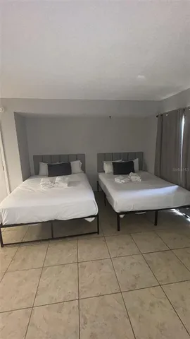 a living room with furniture and a lamp