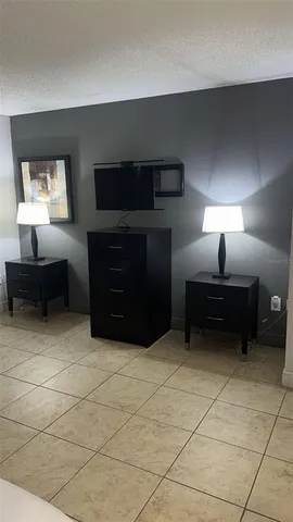 a en suite bathroom with a toilet a sink and mirror