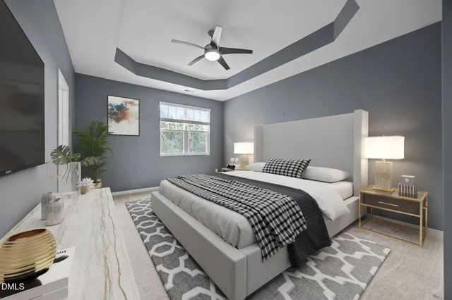 a bedroom with bed and a flat screen tv