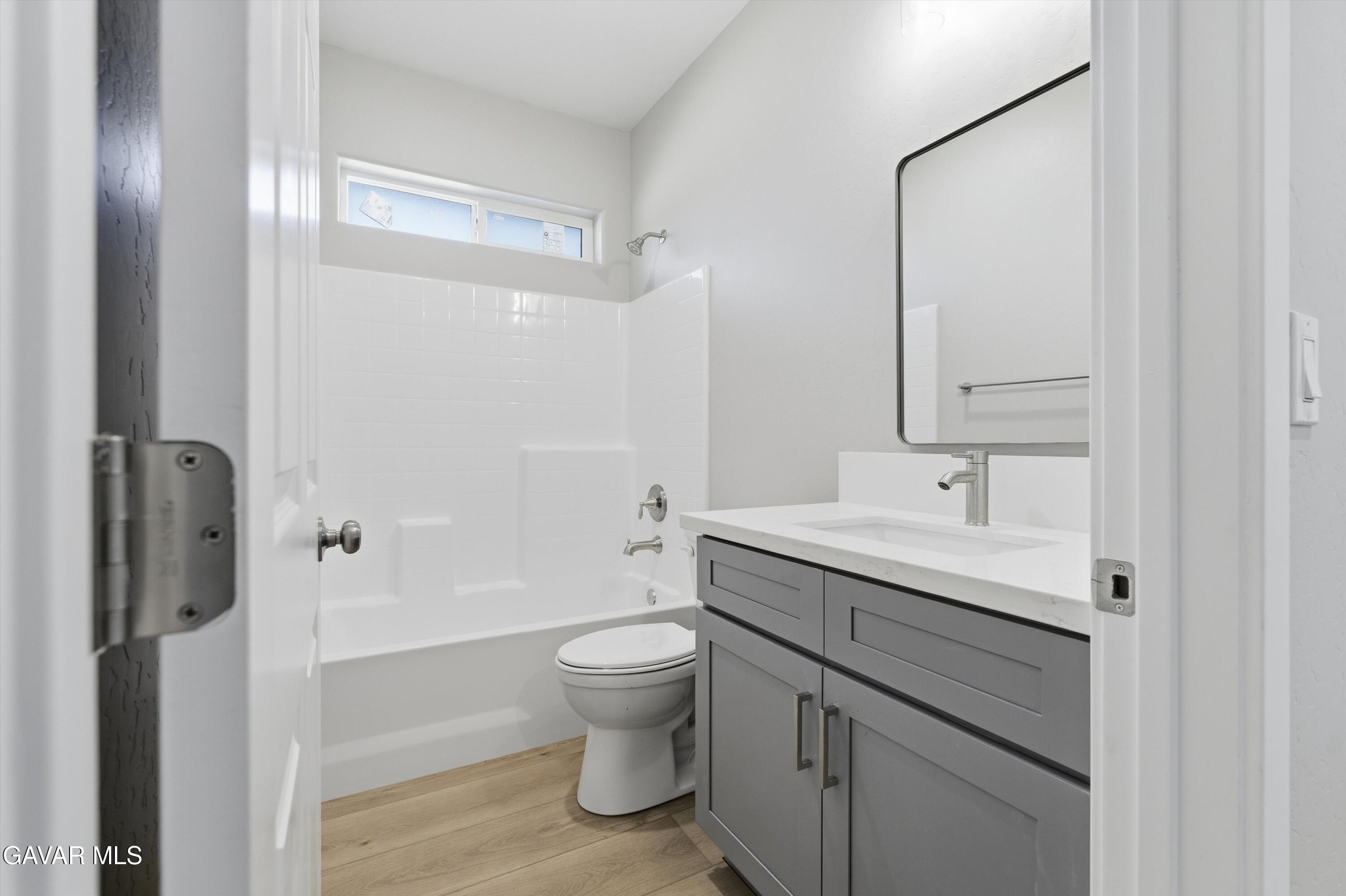 22613 Royal Place Tehachapi, CA 93561 - Photo 13 of 28 a bathroom with a sink toilet and shower