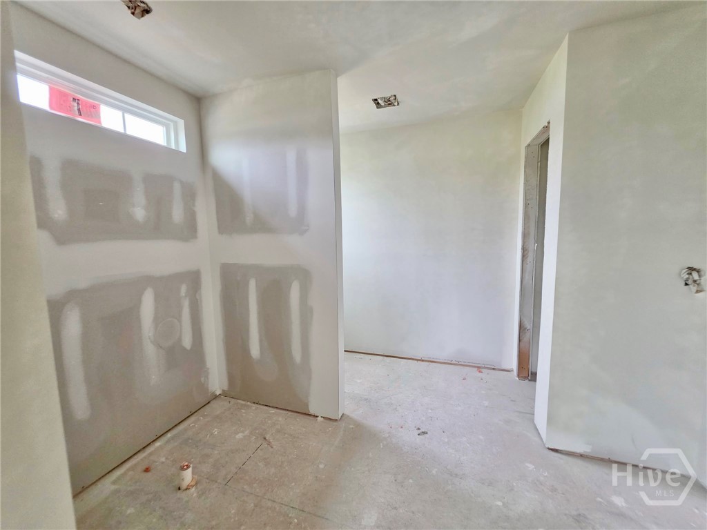 105 Pinebury Road Pooler, GA 31322 - Photo 8 of 13 Primary bathroom. For illustration only. Unit is similar but this may not be the exact unit. Primary bathroom will have a beautiful 5' tiled shower, double sinks with a quartz vanity and framed mirror. HOME IS UNDER CONSTRUCTION.
