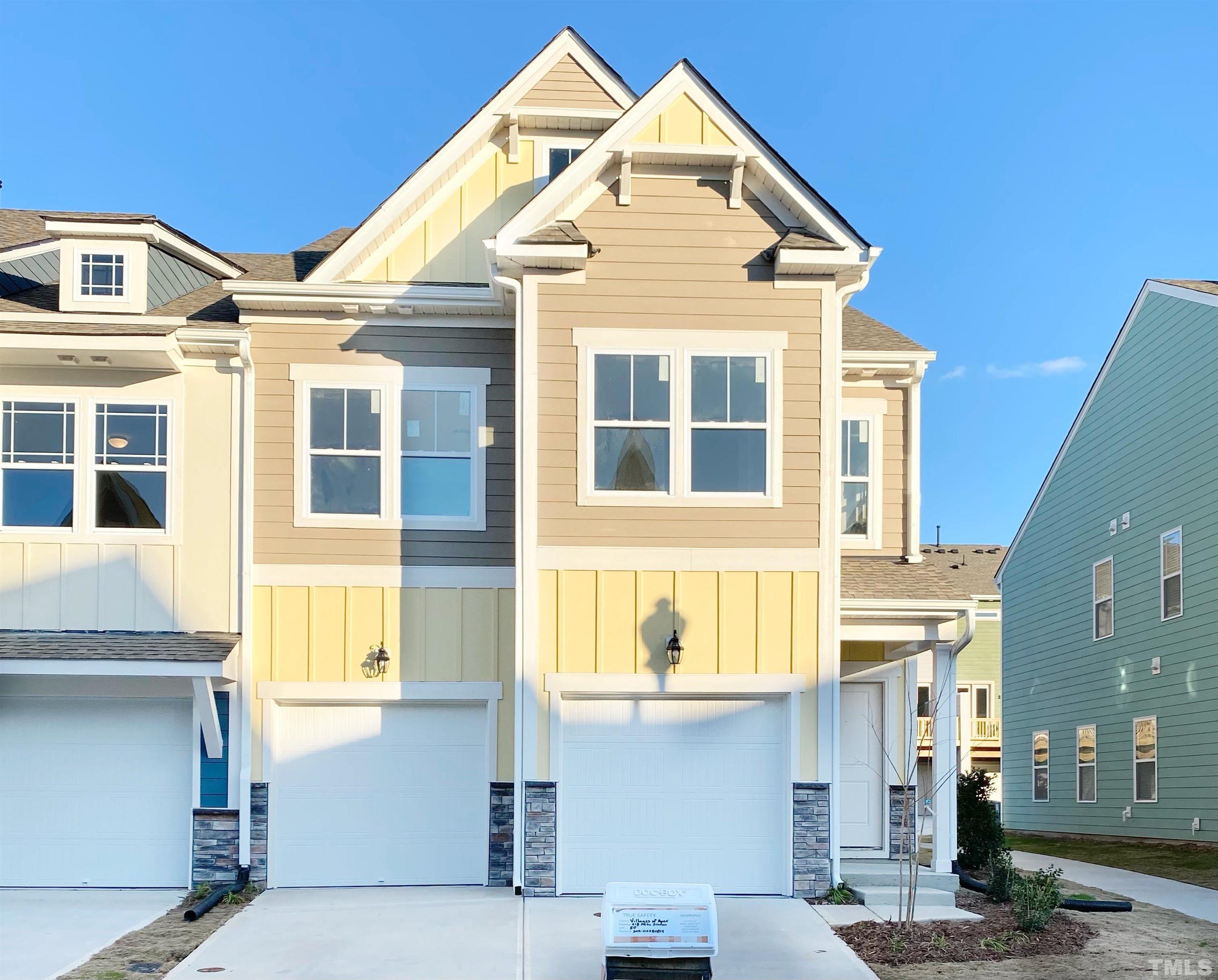 618 Metro Station Apex, NC 27502 - Photo 1 of 11 a front view of a building with a outdoor space