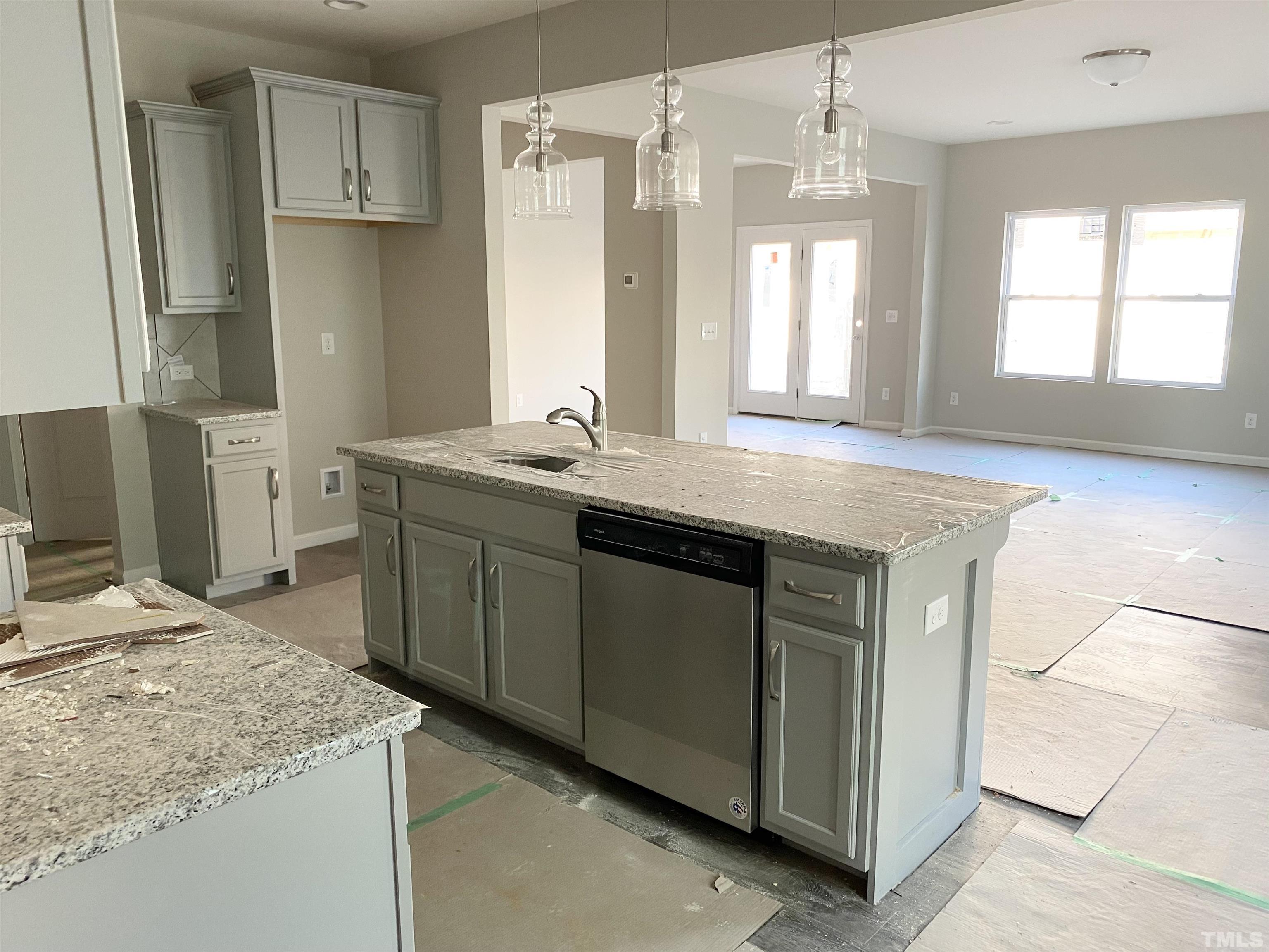 618 Metro Station Apex, NC 27502 - Photo 2 of 11 a kitchen with stainless steel appliances granite countertop a sink stove and refrigerator