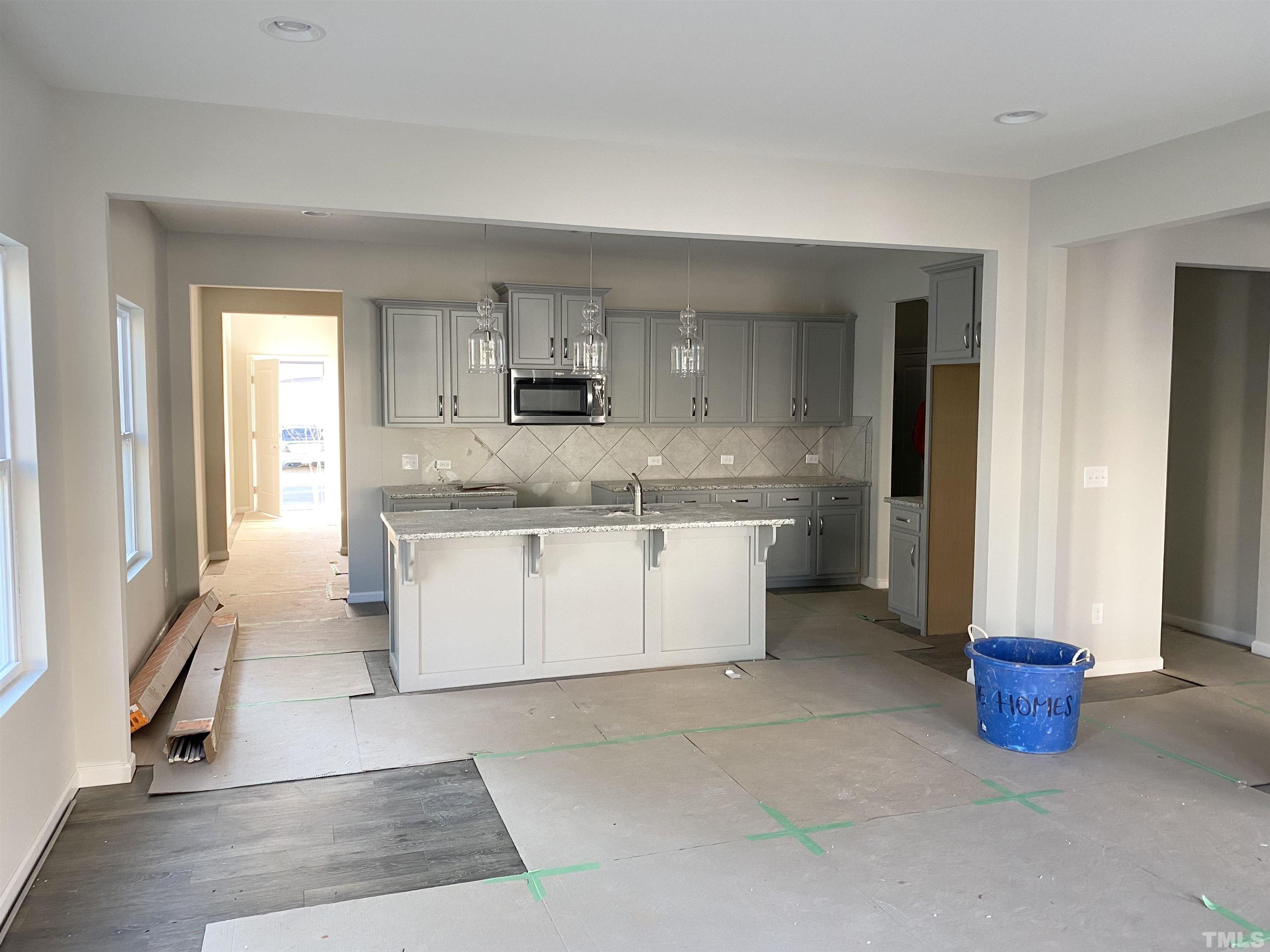 618 Metro Station Apex, NC 27502 - Photo 3 of 11 a large kitchen with cabinets