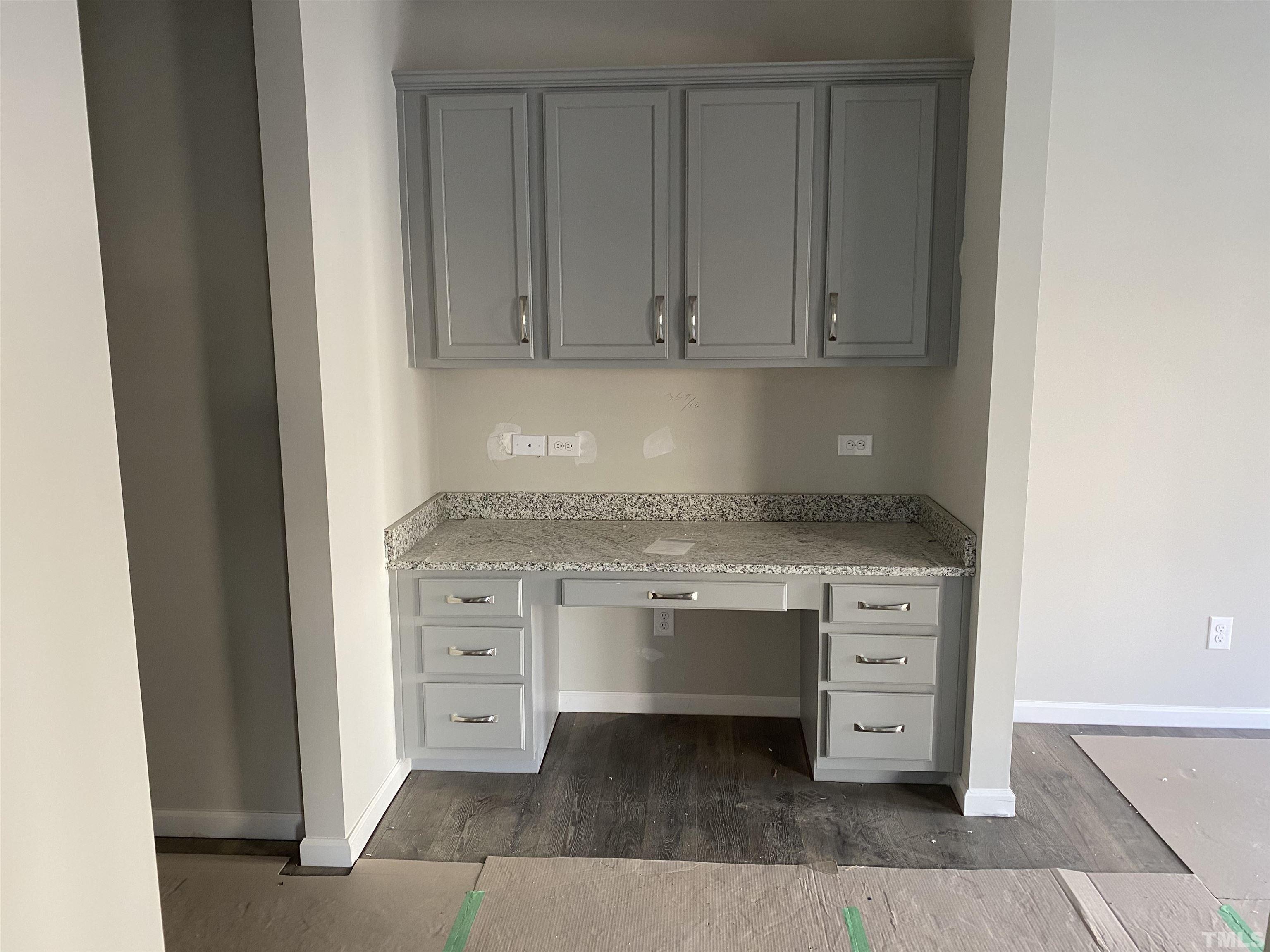 618 Metro Station Apex, NC 27502 - Photo 4 of 11 a view of cabinets and wooden floor