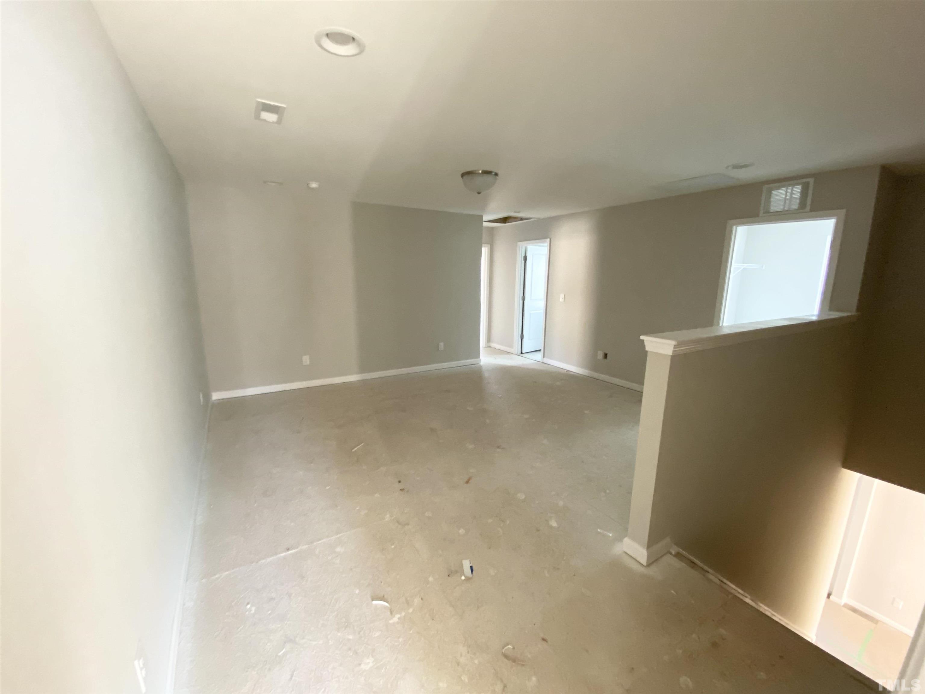 618 Metro Station Apex, NC 27502 - Photo 9 of 11 a view of an empty room with a window
