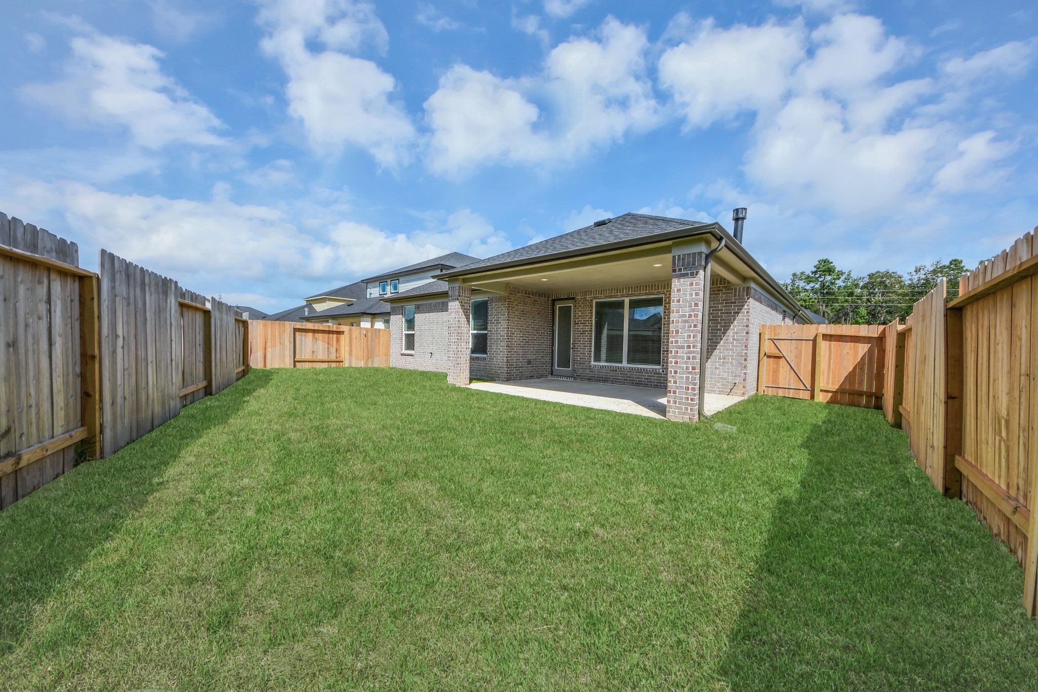 3042 Native Spg Drive Spring, TX 77373 - Photo 36 of 40 Experience outdoor living at its finest on this expansive covered patio, thoughtfully designed for BBQs and delightful outdoor dining.