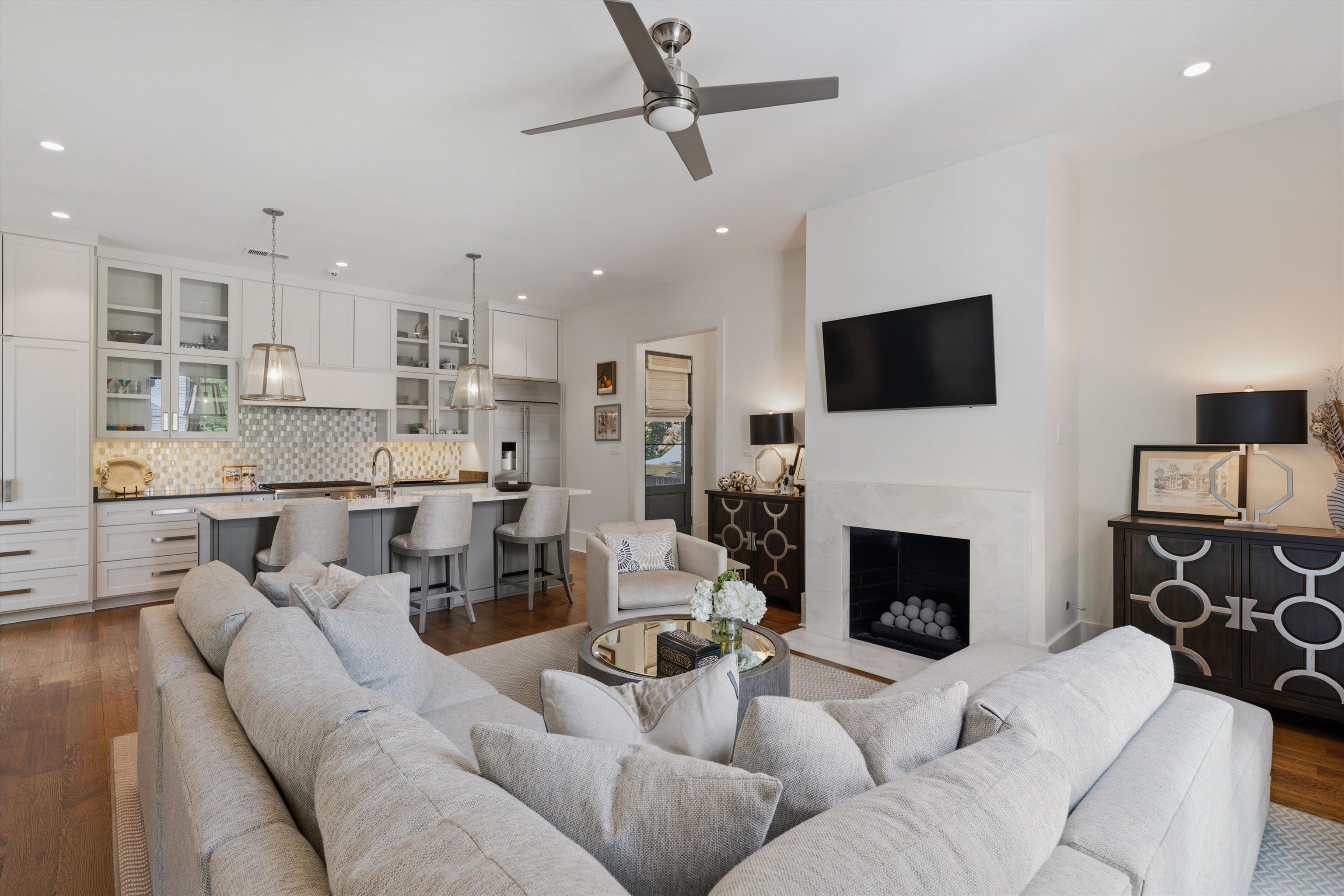 4710 Gwynne Road Memphis, TN 38117 - Photo 31 of 40 a living room with furniture a fireplace and a flat screen tv