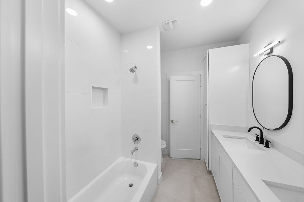 9630 Burden Street Houston, TX 77093 - Photo 11 of 16 a bathroom with a sink and a bathtub