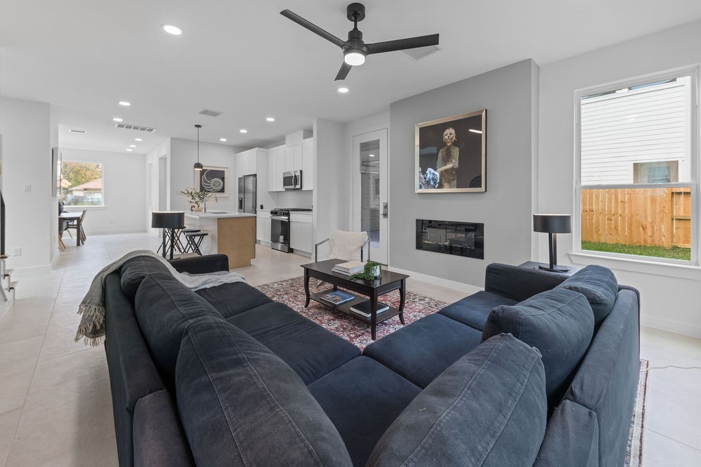 9630 Burden Street Houston, TX 77093 - Photo 2 of 16 a living room with furniture and a fireplace
