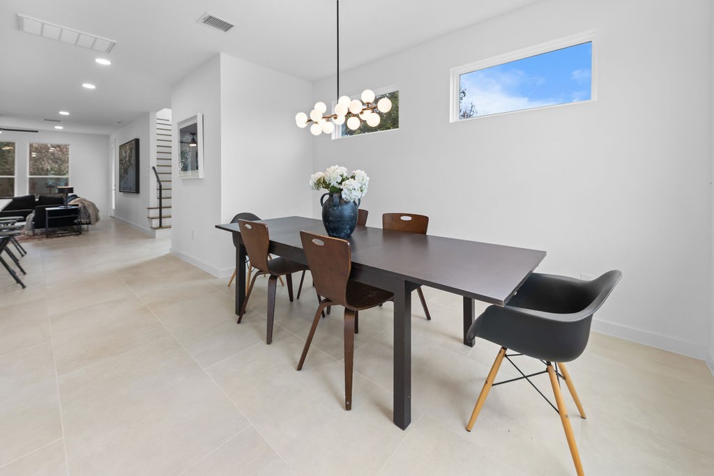 9630 Burden Street Houston, TX 77093 - Photo 6 of 16 a dining room with furniture and chandelier