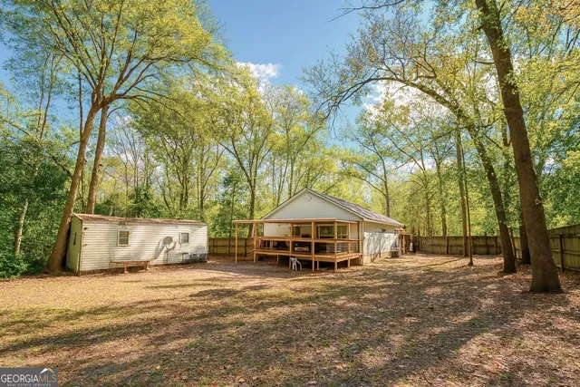 a house that has a tree in front of it