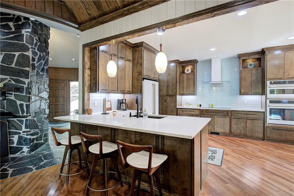 450 Little Hendricks Mountain Road Jasper, GA 30143 - Photo 11 of 61 a kitchen with a table and chairs in it