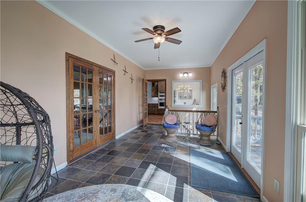450 Little Hendricks Mountain Road Jasper, GA 30143 - Photo 20 of 61 a view of a livingroom with furniture and a ceiling fan