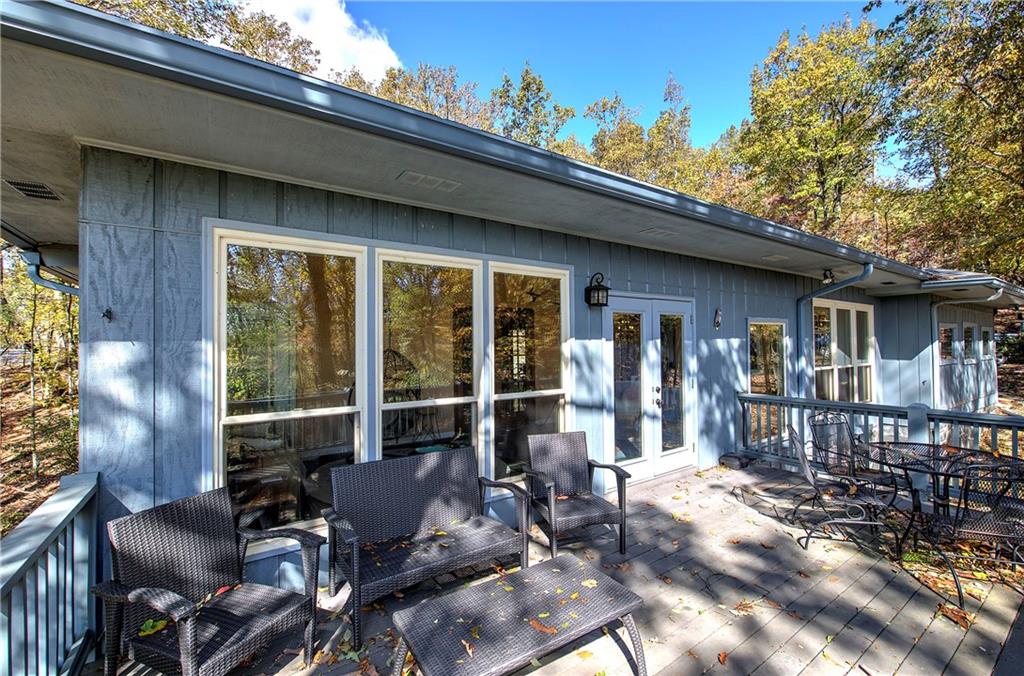450 Little Hendricks Mountain Road Jasper, GA 30143 - Photo 21 of 61 a view of a house with backyard porch and sitting area