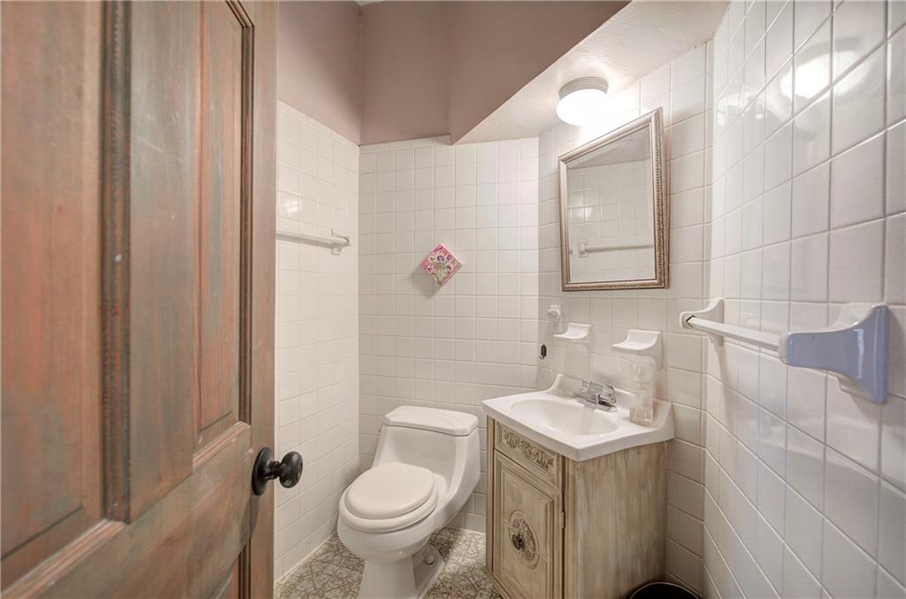 450 Little Hendricks Mountain Road Jasper, GA 30143 - Photo 25 of 61 a bathroom with a sink toilet and shower