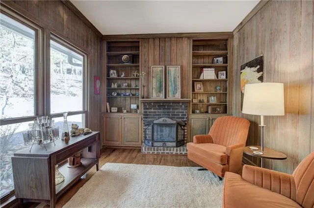 a bedroom with a bed a lamp and a dresser