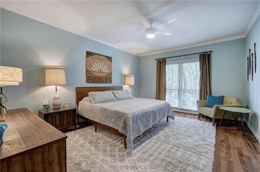 450 Little Hendricks Mountain Road Jasper, GA 30143 - Photo 28 of 61 a spacious bedroom with a bed and wooden floor