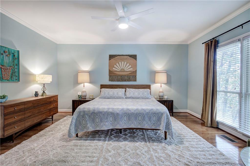 450 Little Hendricks Mountain Road Jasper, GA 30143 - Photo 29 of 61 a bedroom with a bed and a lamp on dresser