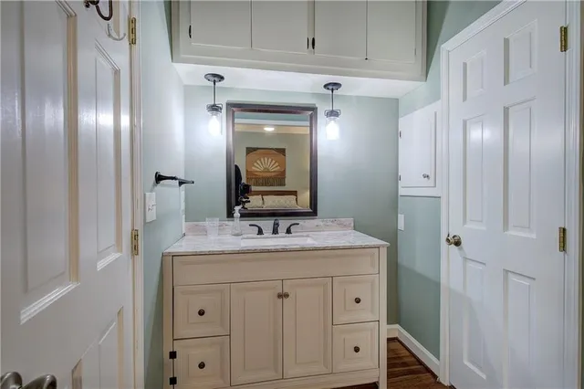 a view of a workspace with furniture and wooden floor