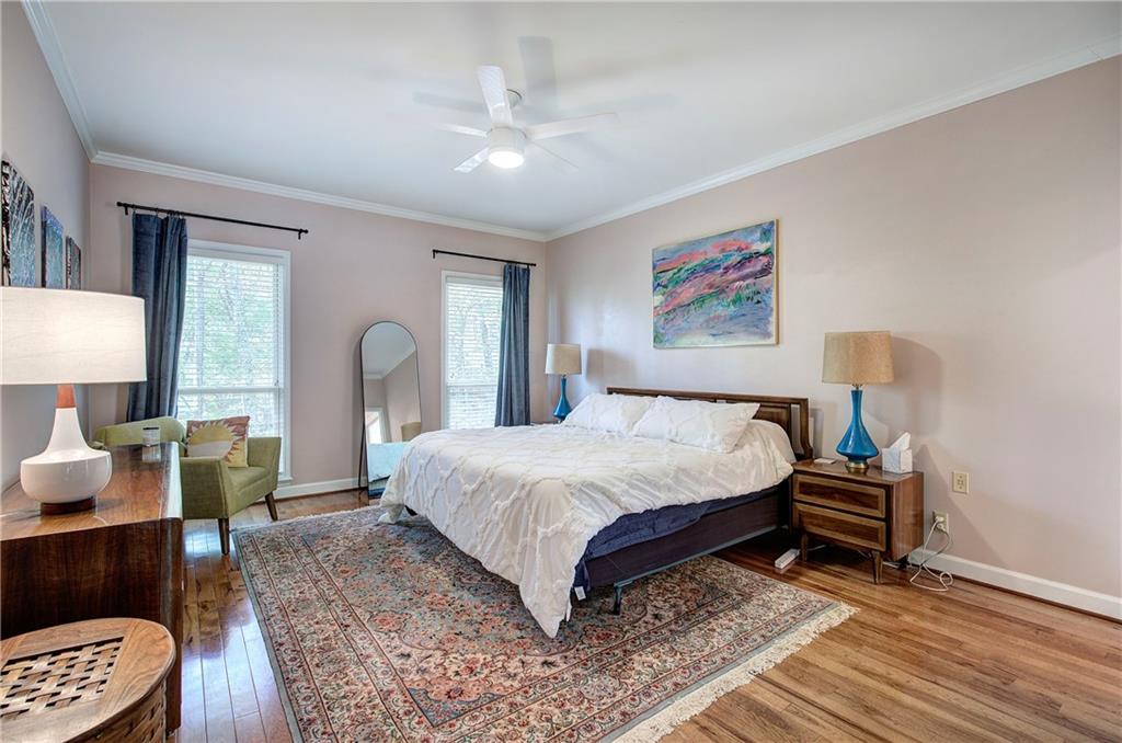 450 Little Hendricks Mountain Road Jasper, GA 30143 - Photo 34 of 61 a bedroom with a bed a lamp and a dresser