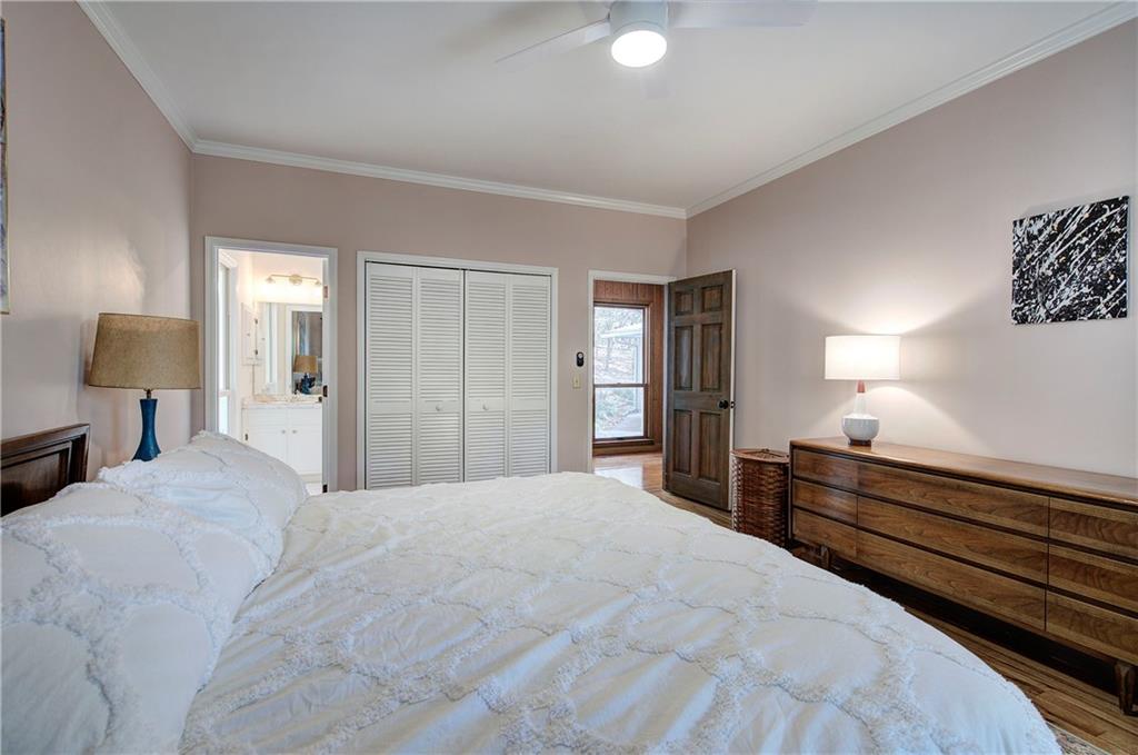 450 Little Hendricks Mountain Road Jasper, GA 30143 - Photo 35 of 61 a bedroom with a bed and wooden floor