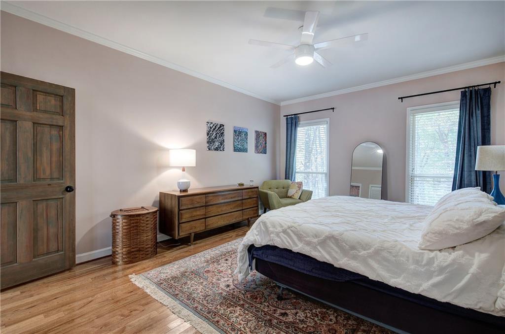 450 Little Hendricks Mountain Road Jasper, GA 30143 - Photo 36 of 61 a bedroom with a bed and wooden floor