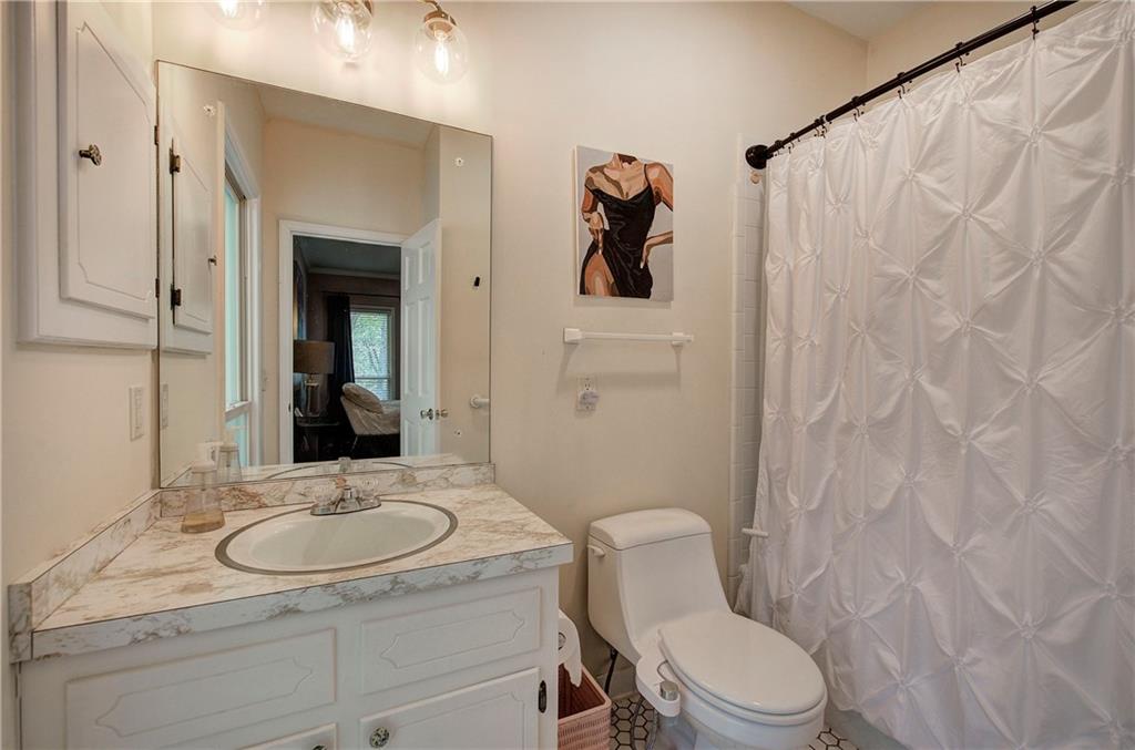 450 Little Hendricks Mountain Road Jasper, GA 30143 - Photo 37 of 61 a bathroom with a sink toilet and shower