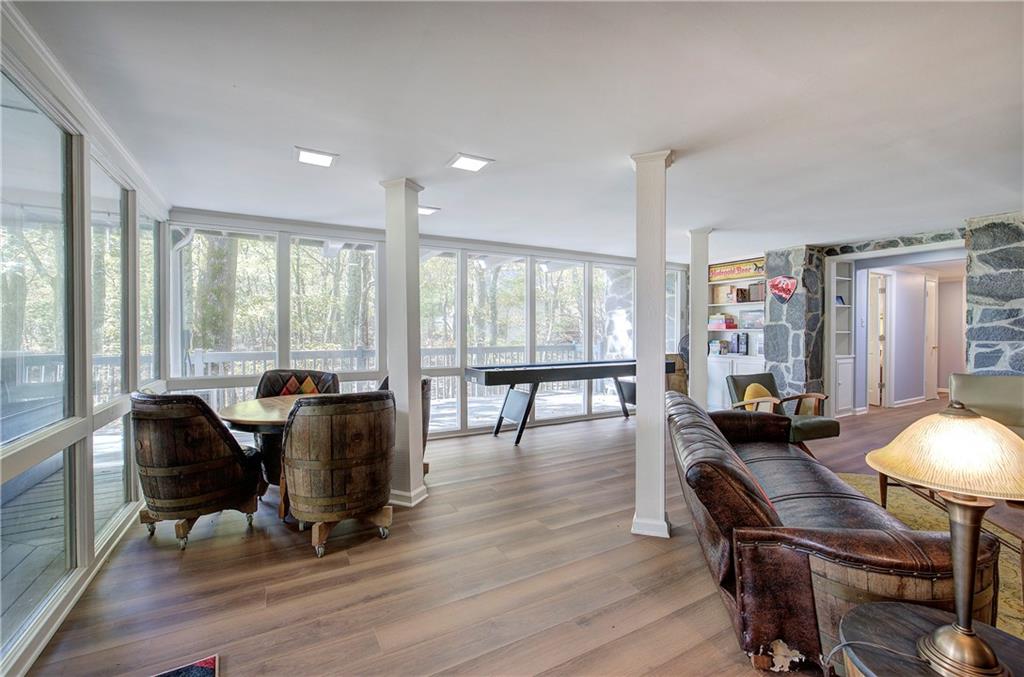 450 Little Hendricks Mountain Road Jasper, GA 30143 - Photo 38 of 61 a view of a workspace with furniture and wooden floor