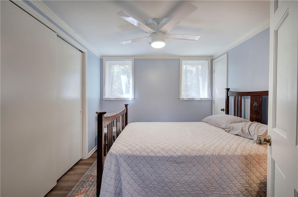 450 Little Hendricks Mountain Road Jasper, GA 30143 - Photo 46 of 61 a bedroom with a bed next to a window