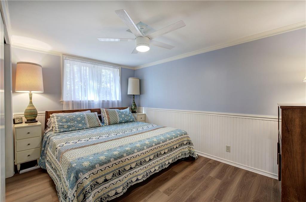 450 Little Hendricks Mountain Road Jasper, GA 30143 - Photo 48 of 61 a bedroom with a bed and a lamp