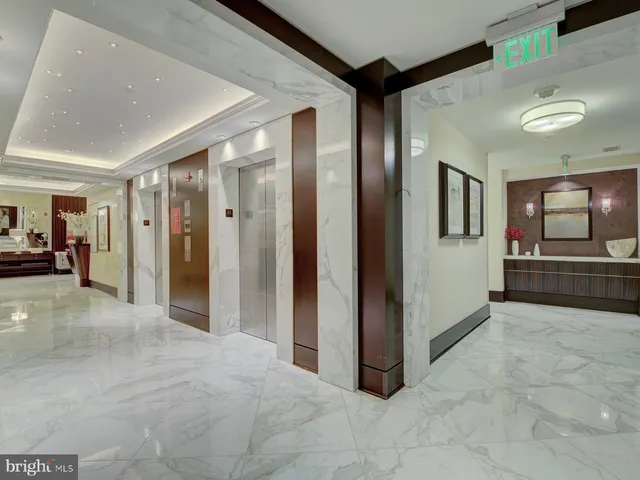 a view of a hallway with living room
