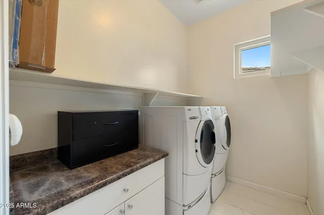 a bathroom with a sink double vanity and a mirror