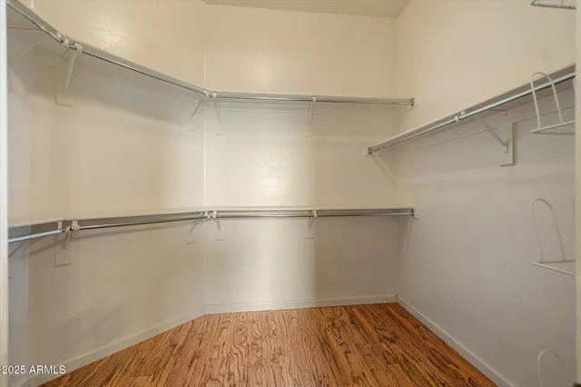 a kitchen with stainless steel appliances granite countertop a refrigerator a stove and a sink