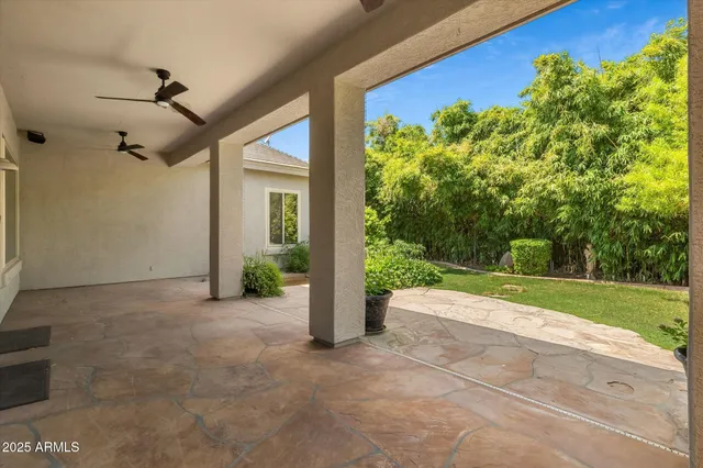 a kitchen with large window appliances and cabinets