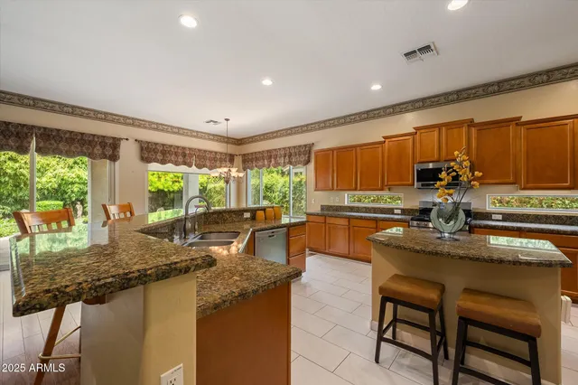 a spacious bathroom with a double vanity sink and a mirror
