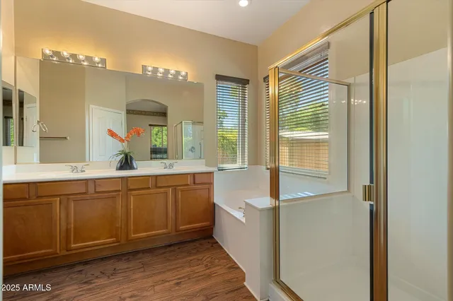 a kitchen with granite countertop a stove top oven microwave and cabinets