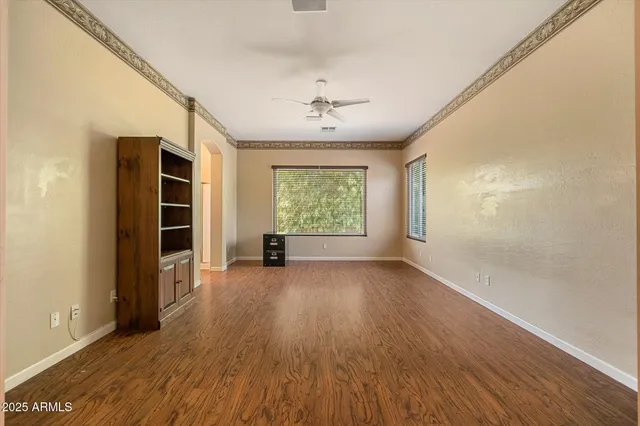 a view of a kitchen with a sink and a refrigerator