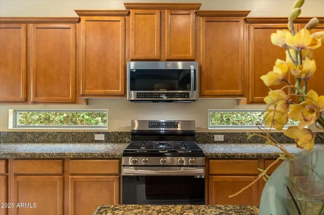 a view of a pathway of a house with a yard